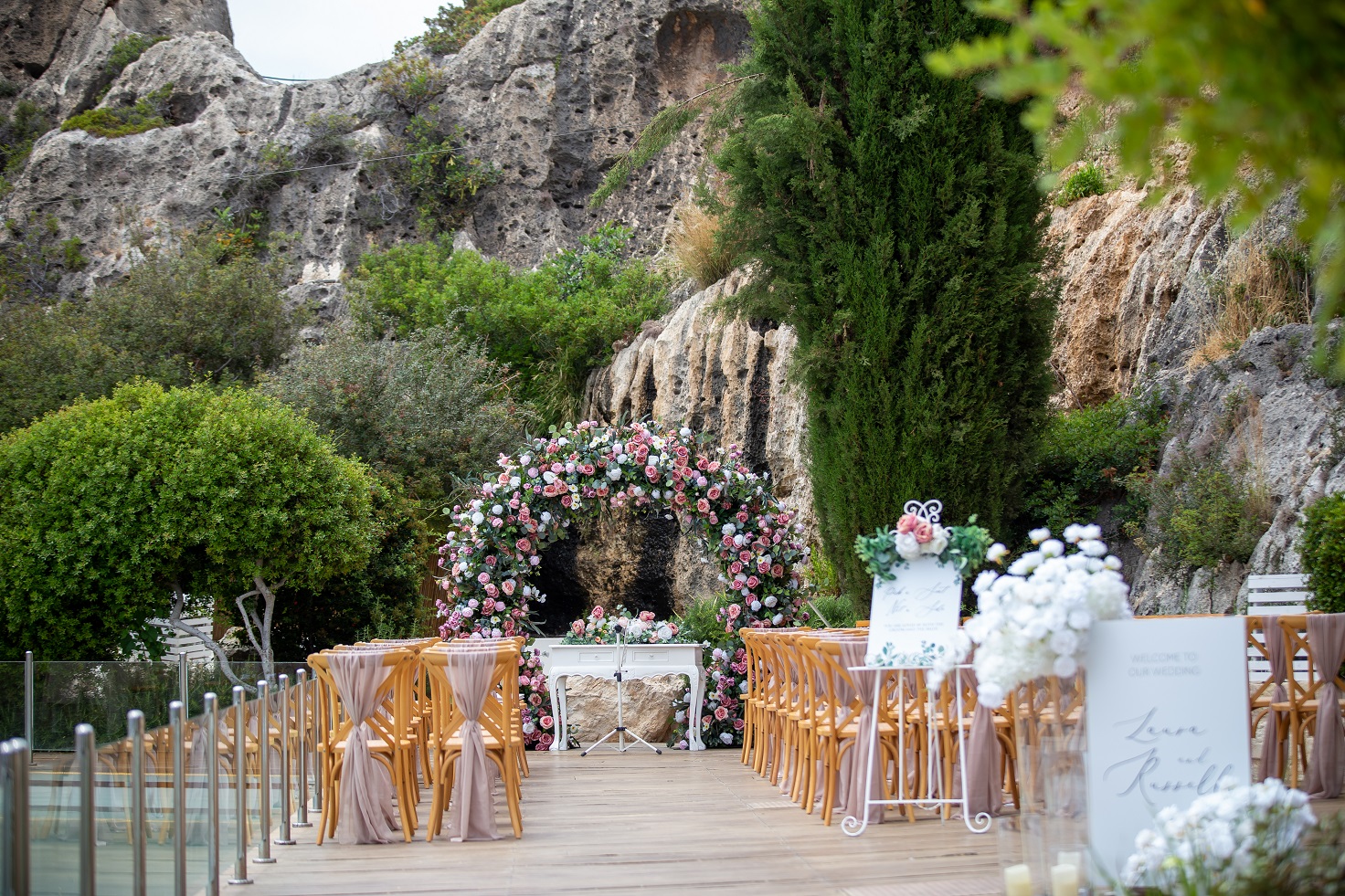 Paliomonastiro venue round arch with dusky pink roses wedding decor Cyprus